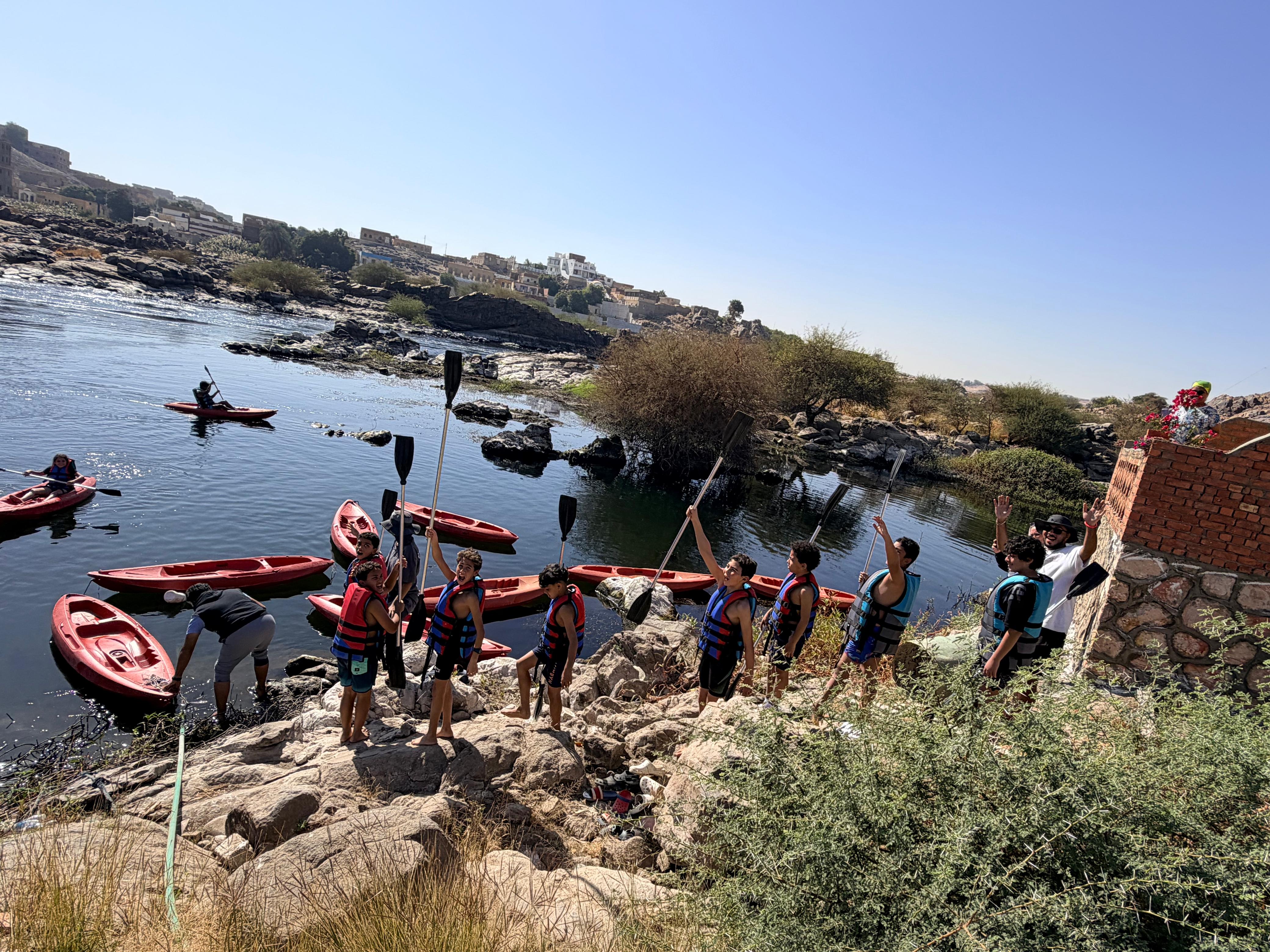 Teens enjoying a kayaking adventure by the Nile in Aswan