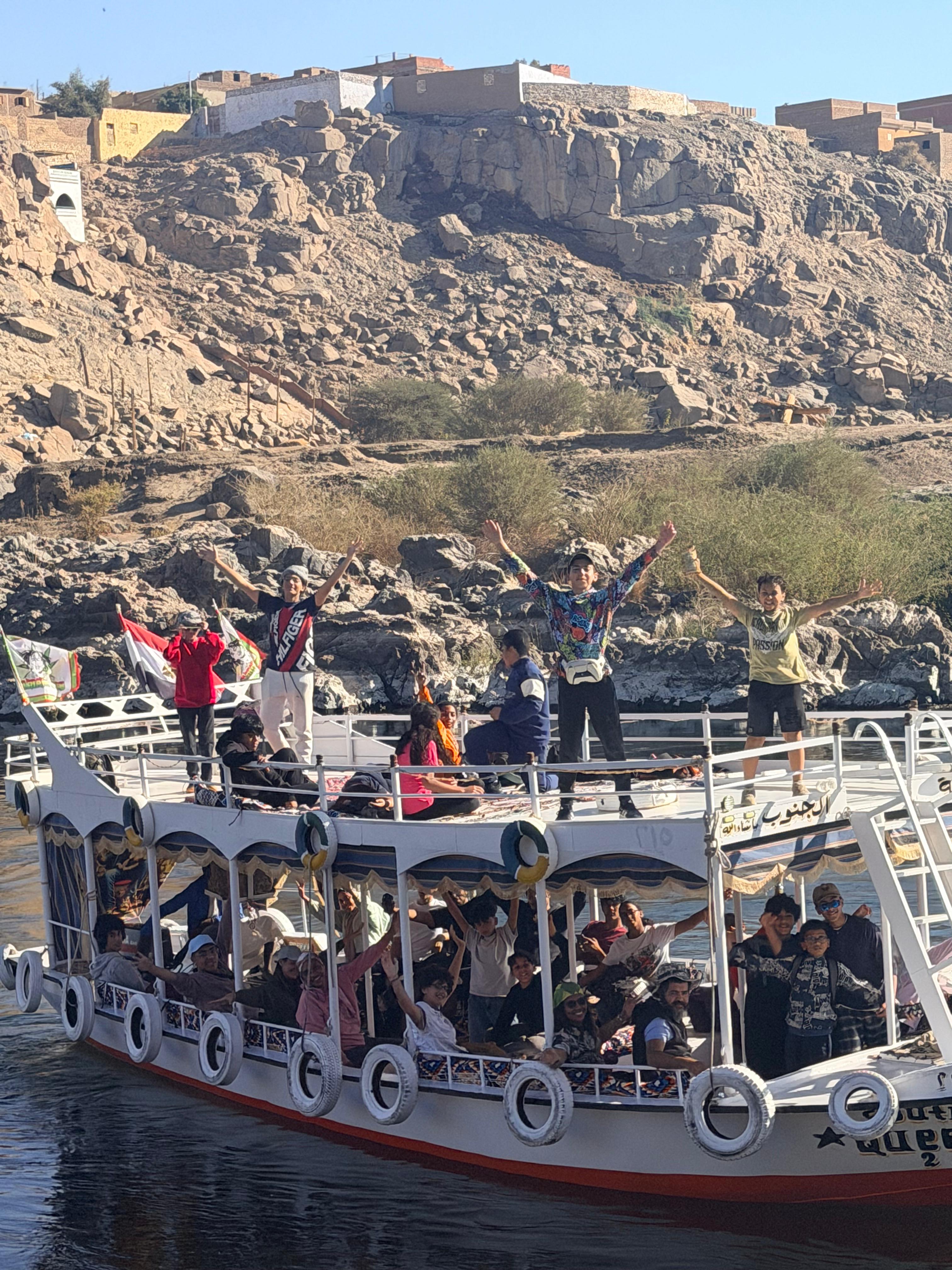 Teen campers celebrating together on a Nile boat trip